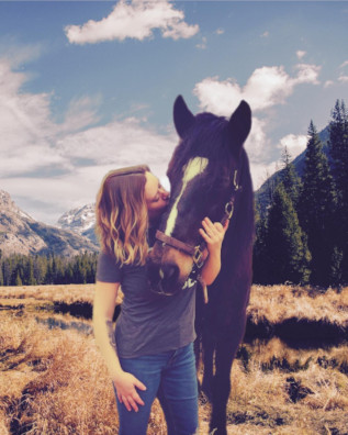 Photo of Amanda and her horse 'Beast'